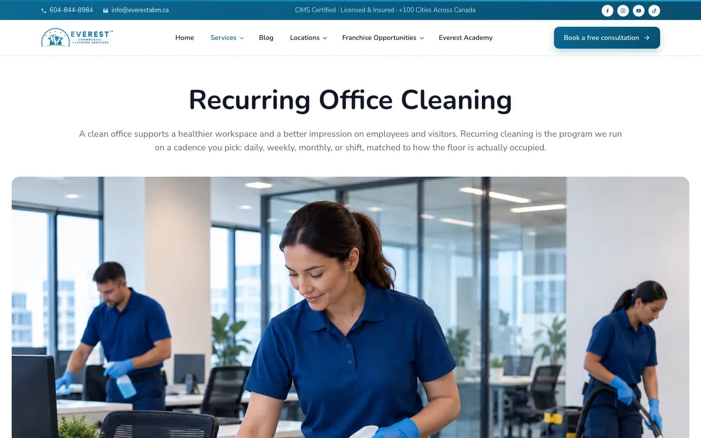 Everest Cleaning recurring office cleaning service page with a cleaning crew at work in an office